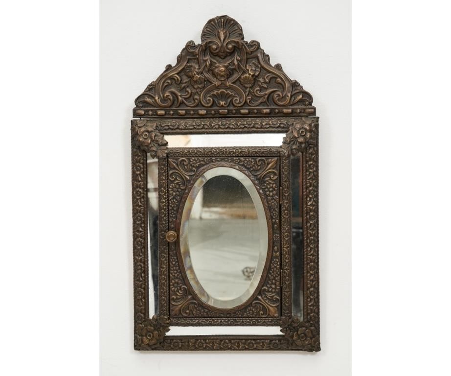 Appraisal: Continental Baroque repousse wall mirror which opens to a brush