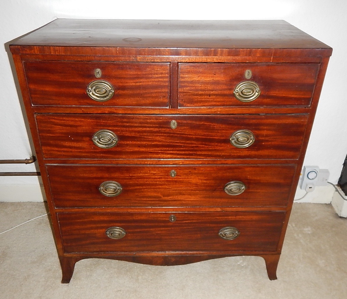 Appraisal: A George III mahogany chest of two short and three