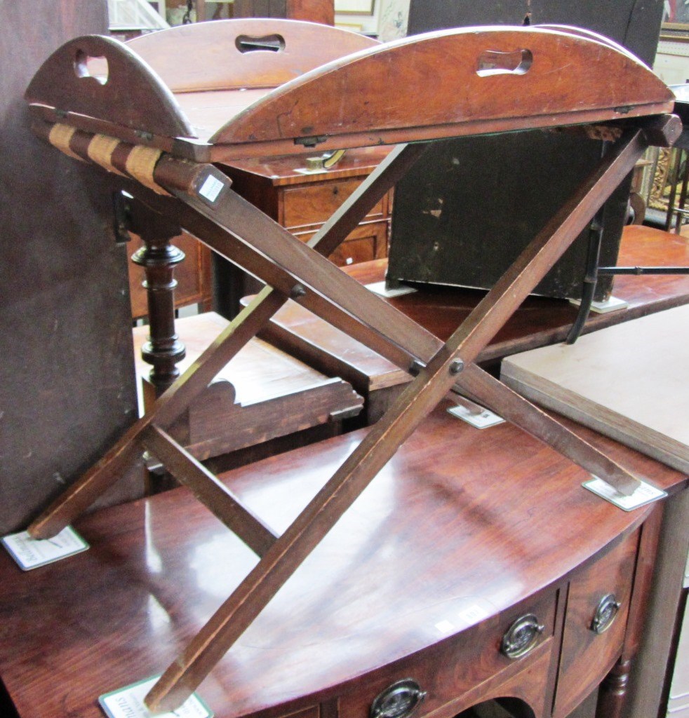 Appraisal: An early th century mahogany drop side butler's tray on