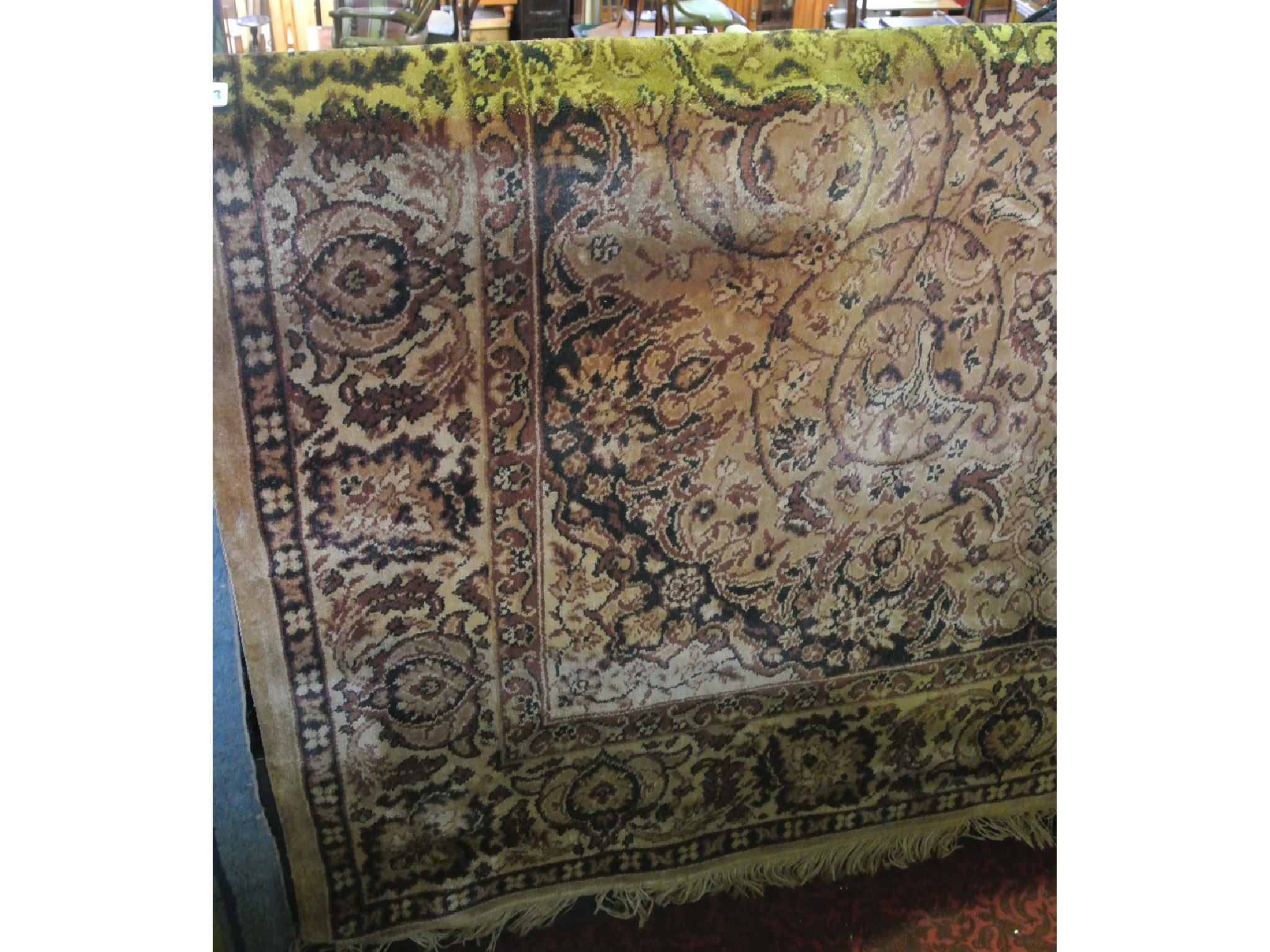 Appraisal: A wool work carpet with beige coloured ground with foliate