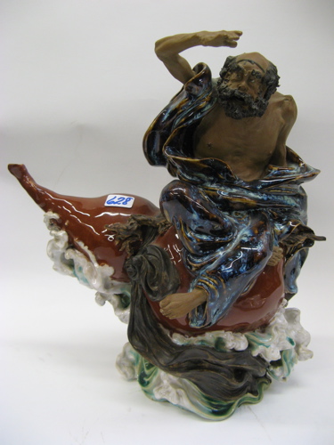 Appraisal: CHINESE POTTERY GLAZED FIGURE the barefoot nearly skeletal man with