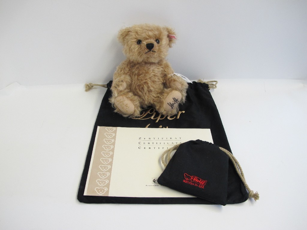 Appraisal: A Hamley's Steiff bear with ear button certificate and pouch