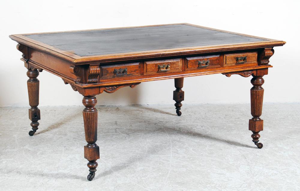 Appraisal: A VICTORIAN LIGHT OAK LIBRARY TABLE moulded edged leather lined