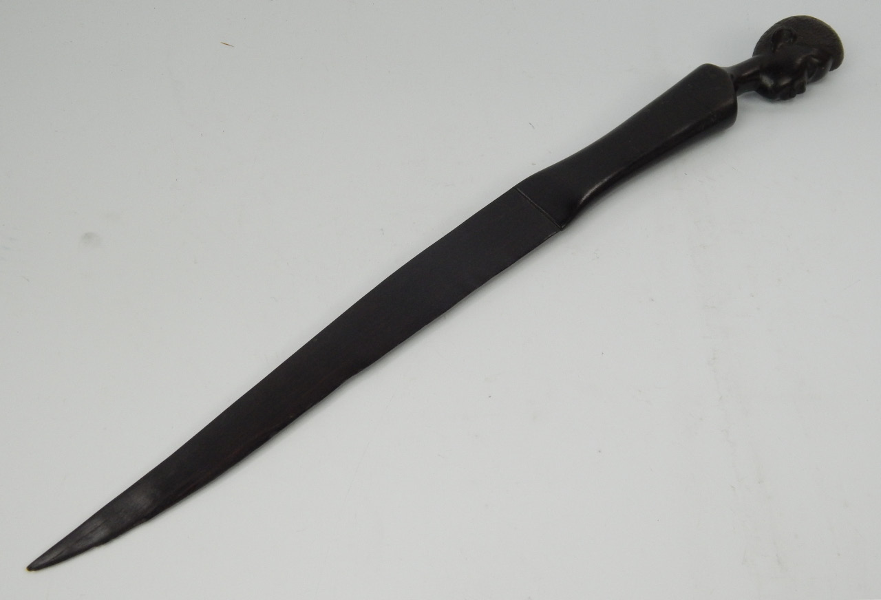 Appraisal: An African carved ebony letter opener the handle carved with