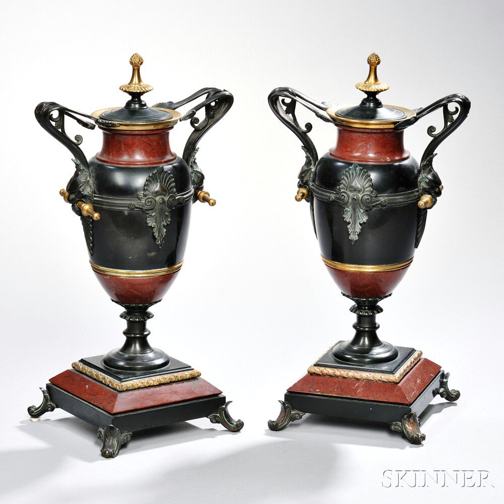 Appraisal: Pair of Neoclassical-style Rouge Marble and Patinated Bronze Urns probably