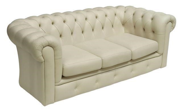 Appraisal: English Chesterfield three-seat sofa late th c in creamy white