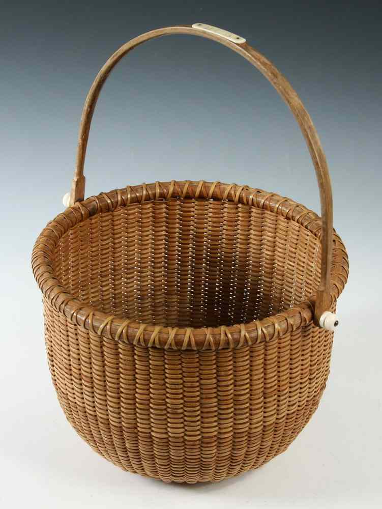 Appraisal: NANTUCKET BASKET - Nantucket Swing Handle Basket open round format