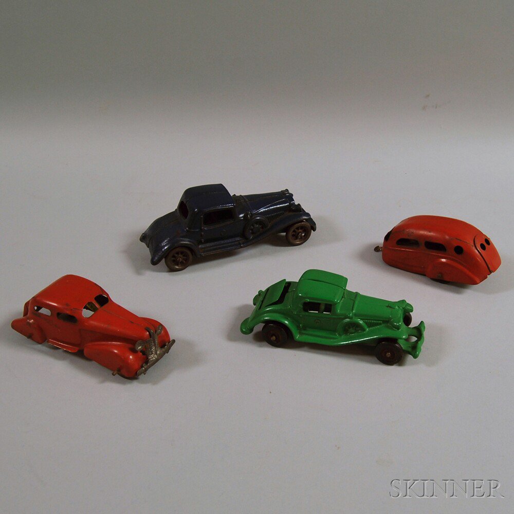 Appraisal: Four Toy Metal Vehicles a navy blue Champion cast iron