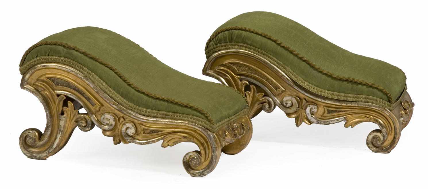 Appraisal: A pair of Rococo Revival parcel gilt and silvered footstools