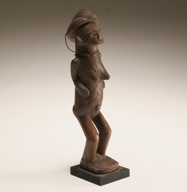 Appraisal: African carved wooden standing female figure Gabon scarification patterns to