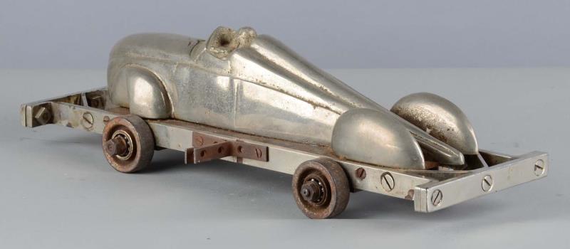 Appraisal: Heavy Cast Iron Bump Car Toy This heavy streamlined toy