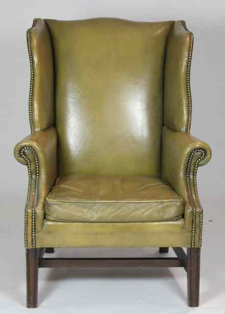 Appraisal: A George III style wing armchair upholstered in green leather