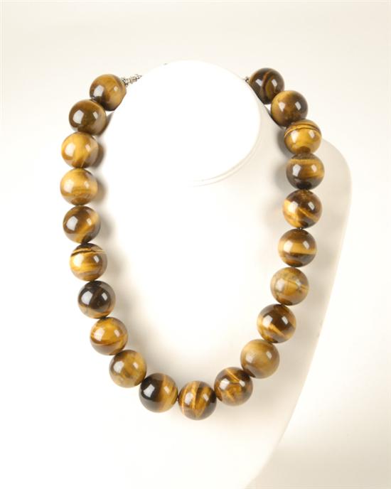 Appraisal: A Tiger's Eye Bead Necklace with enormous beads mm each