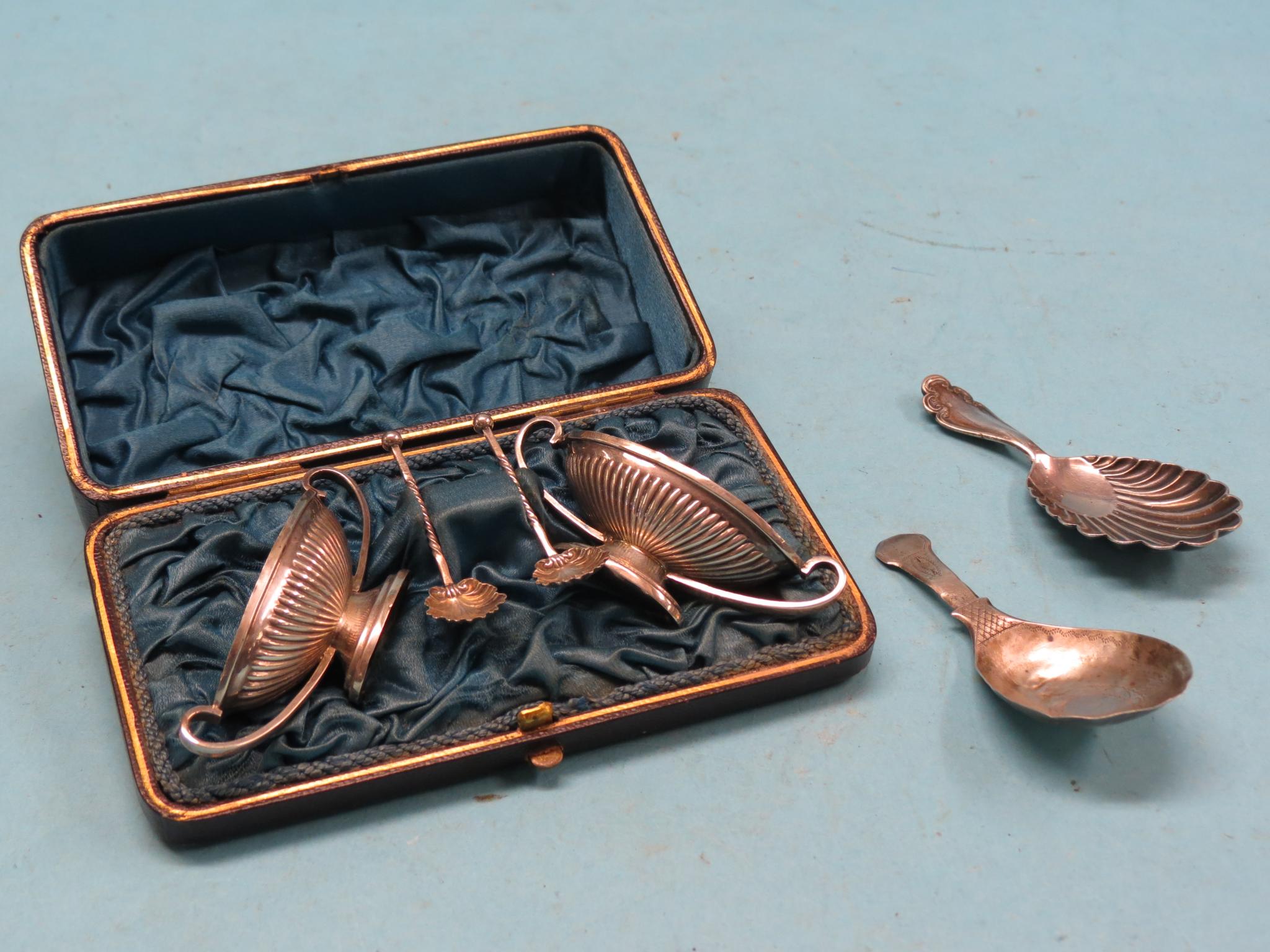 Appraisal: A pair of silver pedestal salts with server spoons in