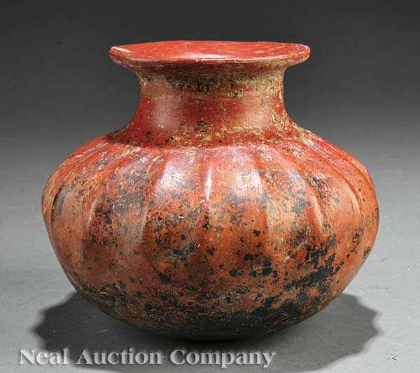 Appraisal: A Pre-Columbian Pottery Gadrooned Vessel Colima lobed globular body issuing