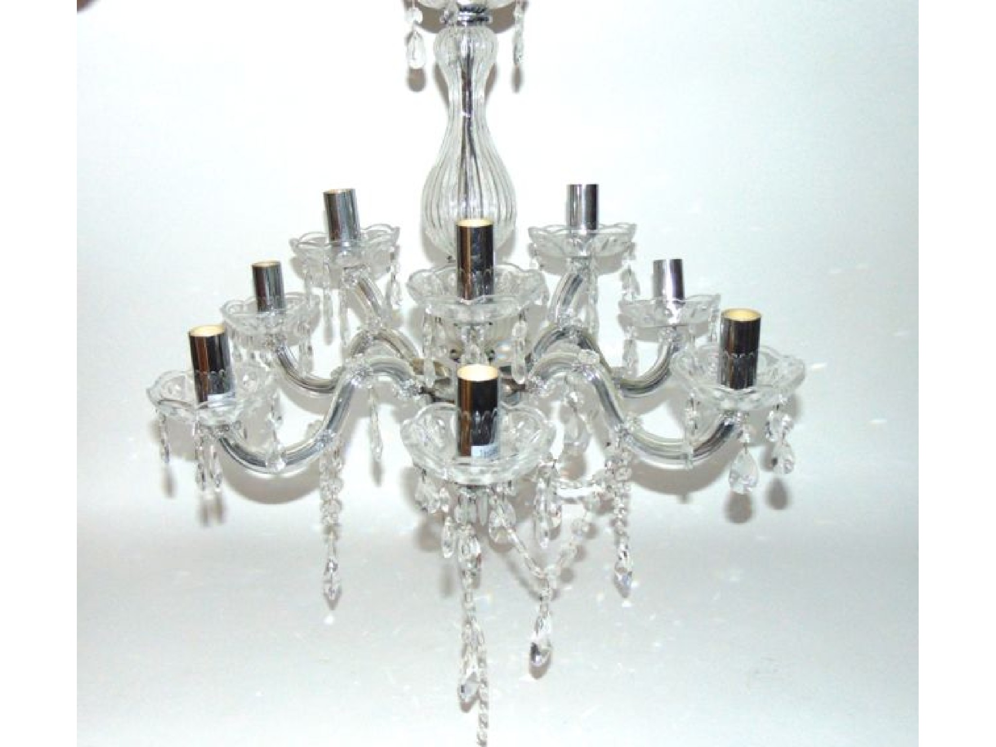 Appraisal: A contemporary ceiling light electrolier in simulated cut glass with