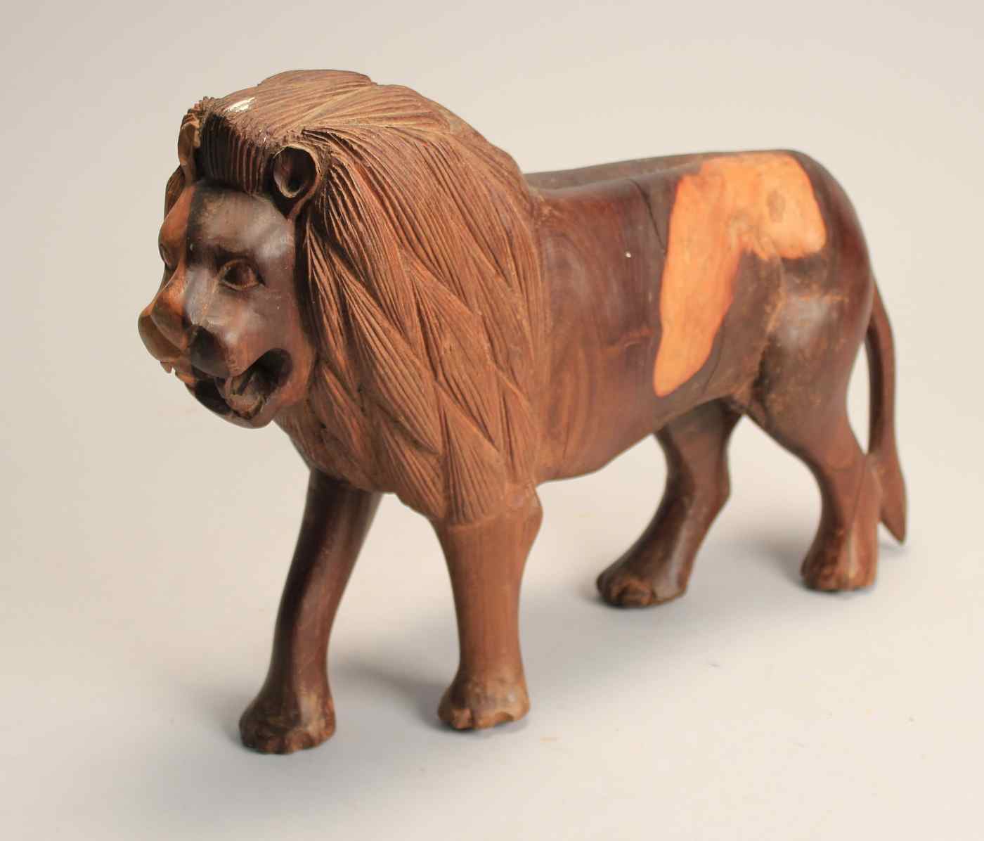 Appraisal: CARVED LIGNUM VITAE FIGURE OF A LION th CenturyHeight Length