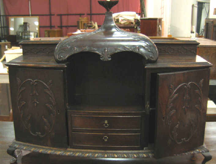 Appraisal: CHIPPENDALE STYLE MAHOGANY DESK CABINET In the form of a