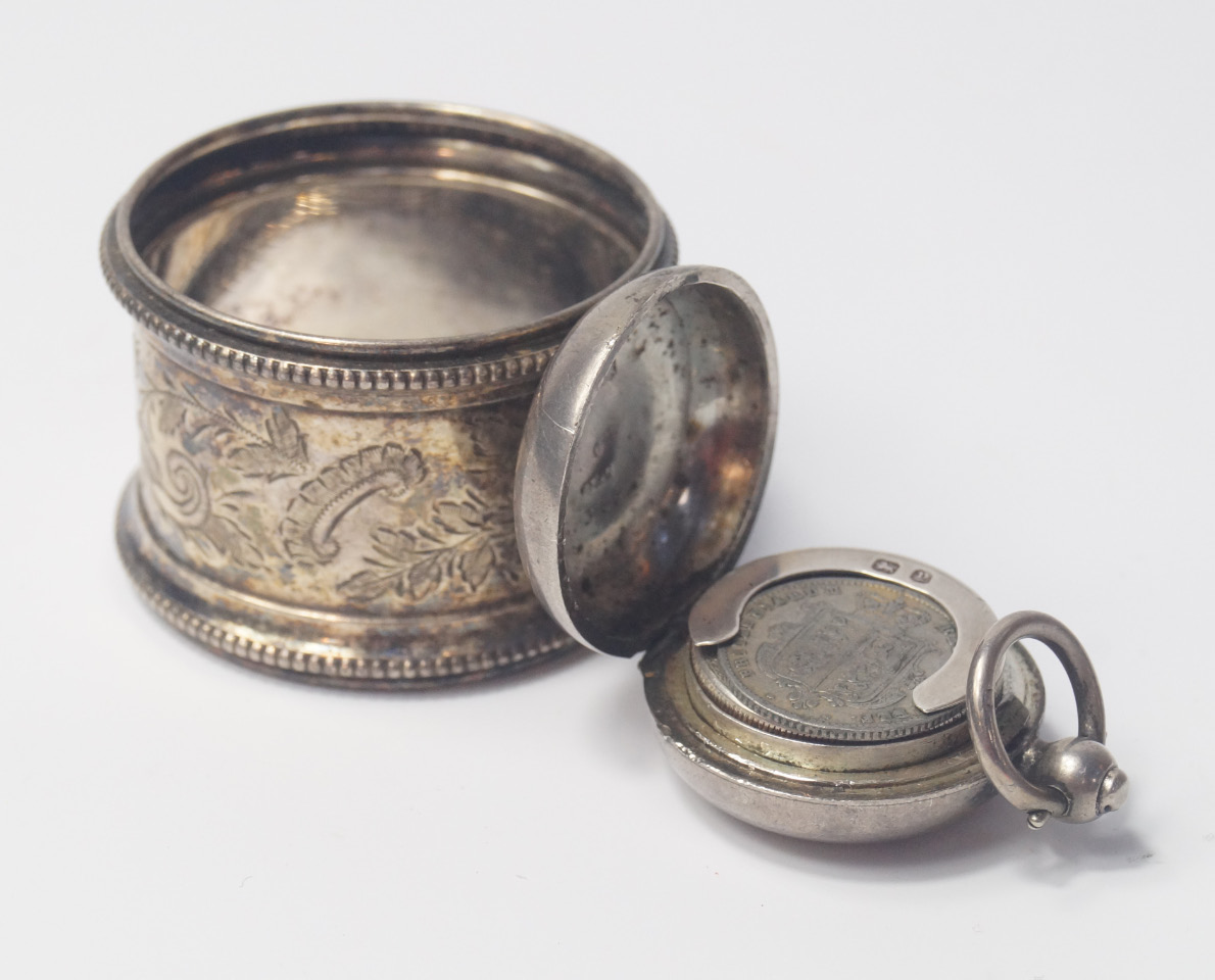 Appraisal: A Victorian silver sovereign case Birmingham and a silver napkin