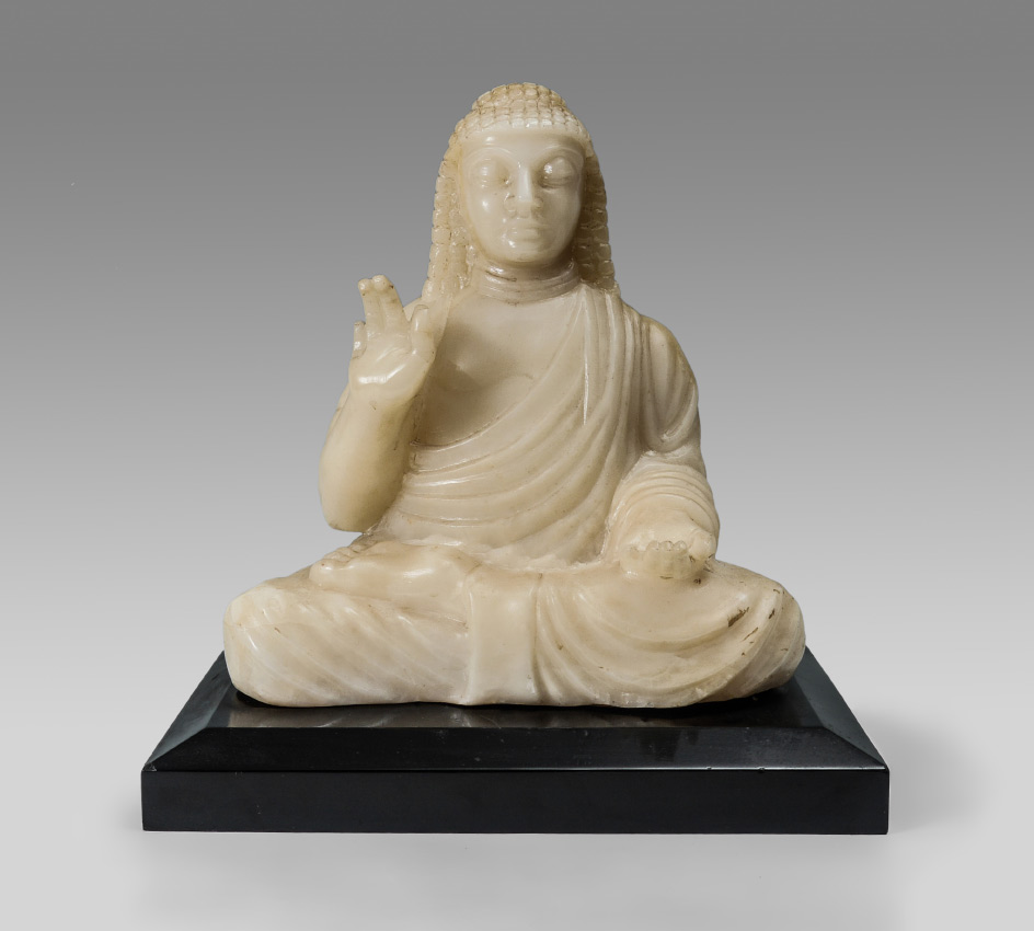 Appraisal: ORIENTAL CARVED STONE SEATED BUDDHA Carved white hard stone figure