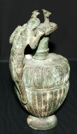 Appraisal: A bronze ewer the handle formed with a nude half