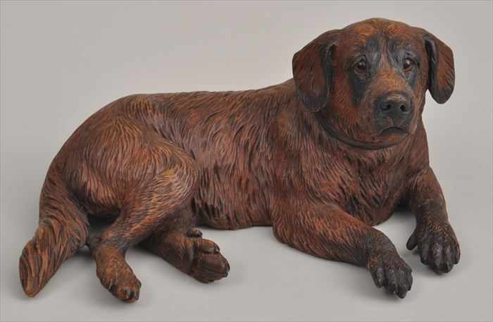 Appraisal: BLACK FOREST CARVED WALNUT FIGURE OF A RECUMBENT HOUND Inset