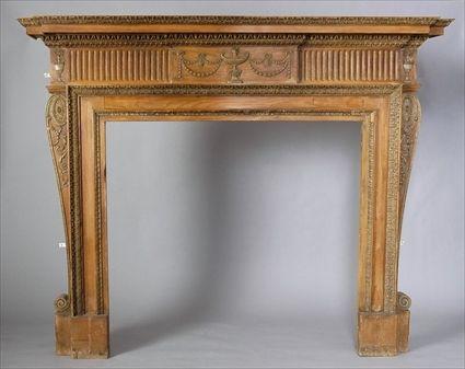 Appraisal: GEORGE III-STYLE CARVED PINE AND GESSO CHIMNEYPIECE The breakarch shelf