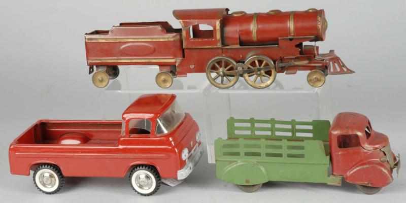 Appraisal: Lot of Trucks Description Includes a pressed steel Hill Climber