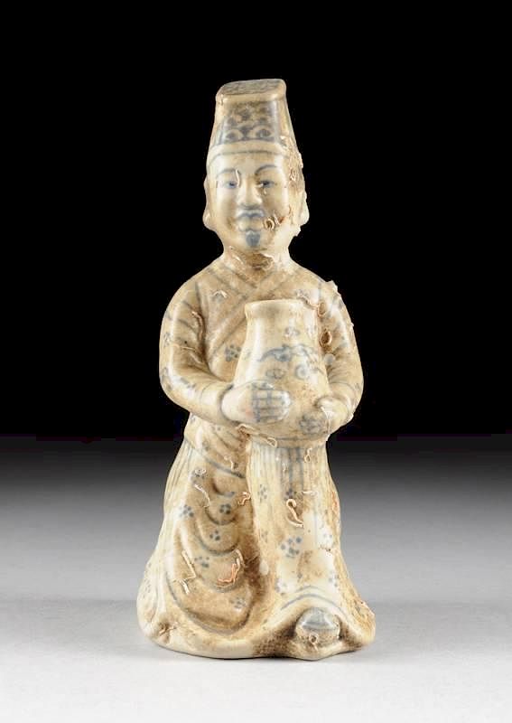 Appraisal: A VIETNAMESE ANNAMESE BLUE AND WHITE PORCELAIN COURT OFFICIAL POSSIBLY