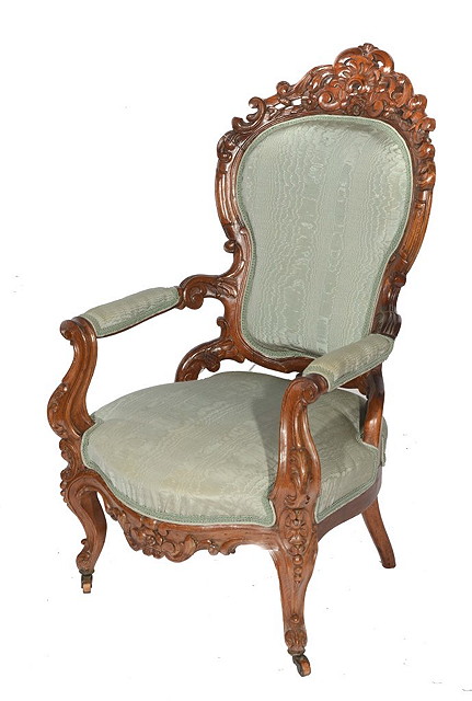 Appraisal: AN ITALIAN WALNUT FRAMED OPEN ARMCHAIR with foliate scroll carved