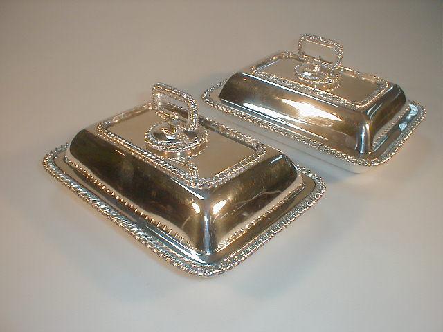 Appraisal: A pair of Walker and Hall electroplate entree dishes and