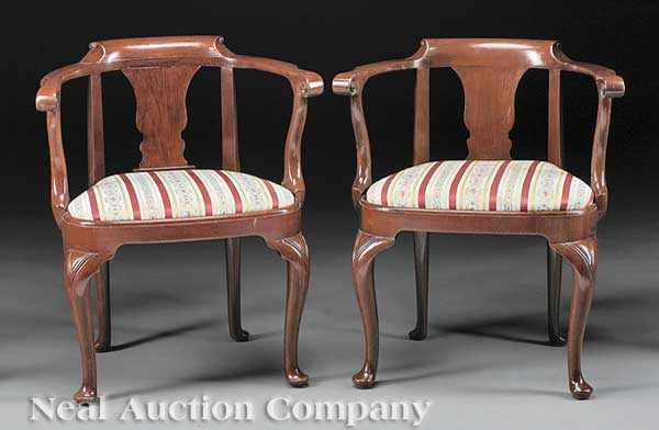 Appraisal: A Pair of George I-Style Mahogany Armchairs the yoke shaped