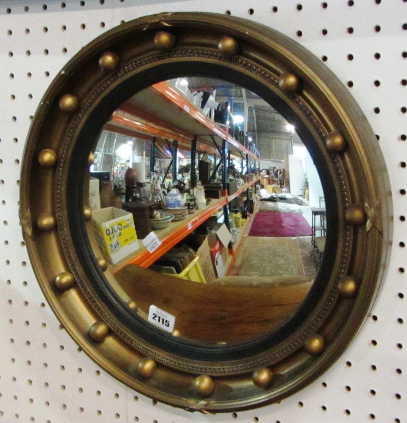 Appraisal: A th century convex gilt mirror