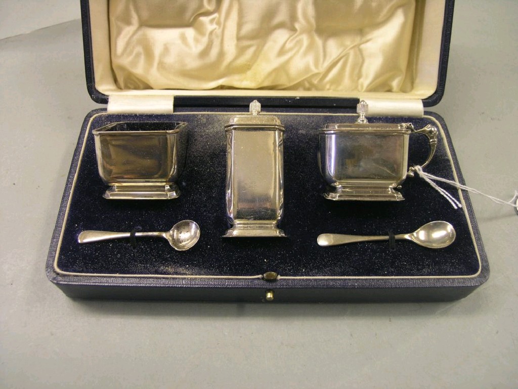 Appraisal: A silver condiment set consisting of salt pepper and mustard