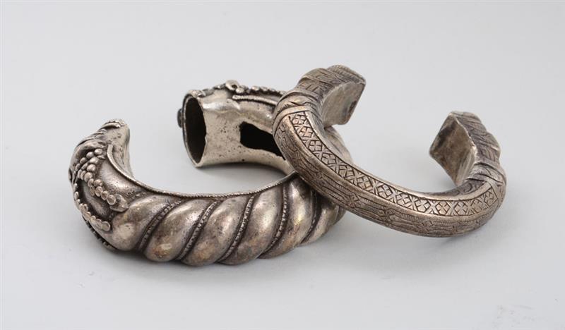 Appraisal: TWO ASIAN SILVERED METAL BANGLE BRACELETS Each with dragon-head ends