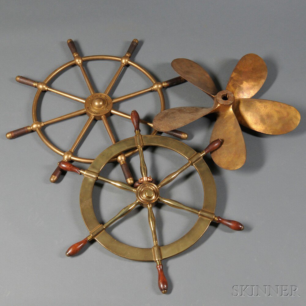 Appraisal: Two Brass Ship's Wheels and a Propeller th century the