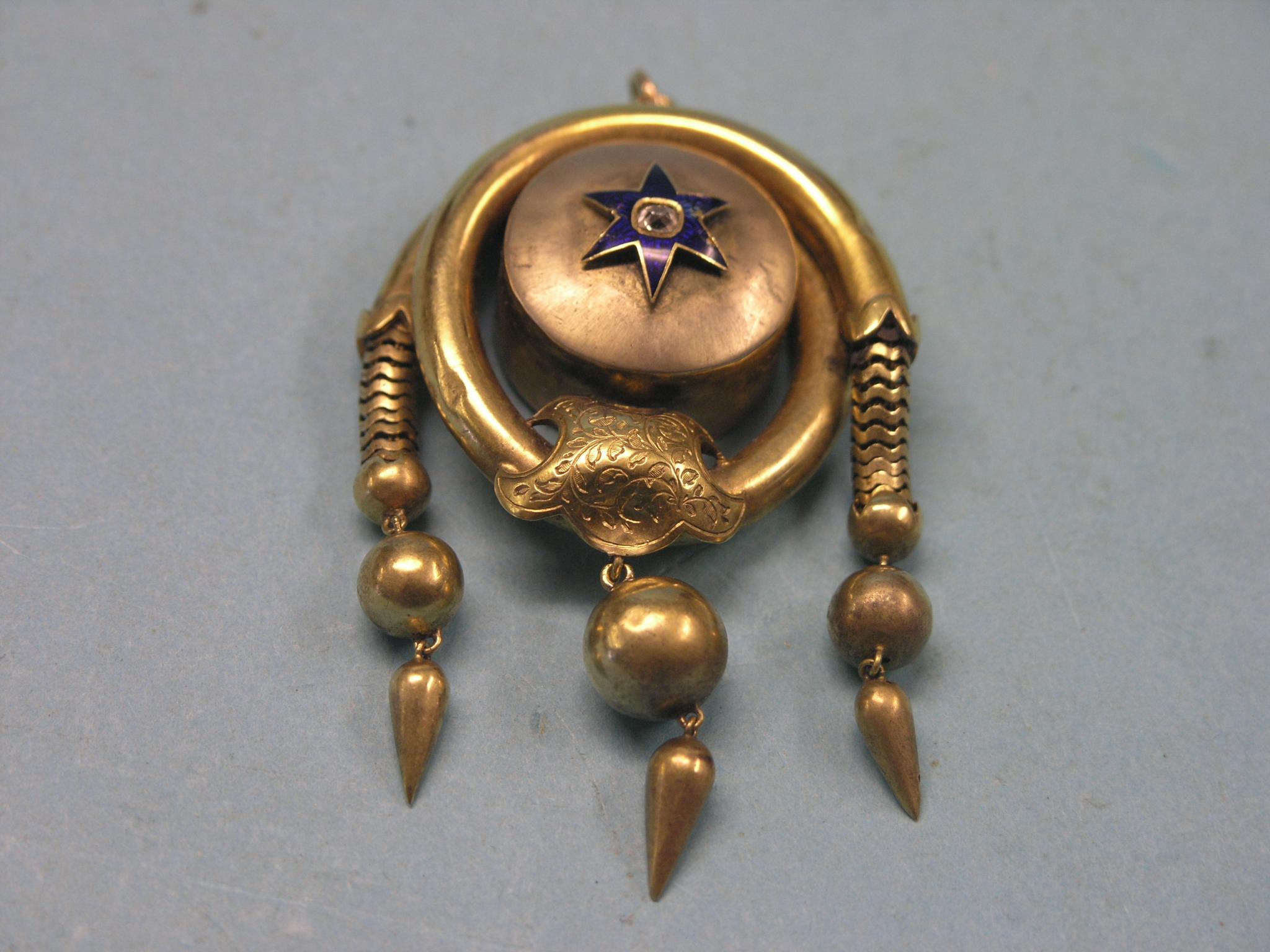 Appraisal: An unusual yellow metal pendant single diamond set within blue-enamelled