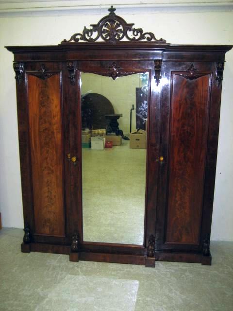 Appraisal: A VICTORIAN MAHOGANY TRIPLE WARDROBE of breakfront from the moulded