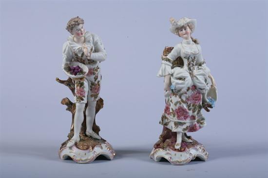 Appraisal: PAIR CONTINENTAL PORCELAIN FIGURES early th century Modelled as lady