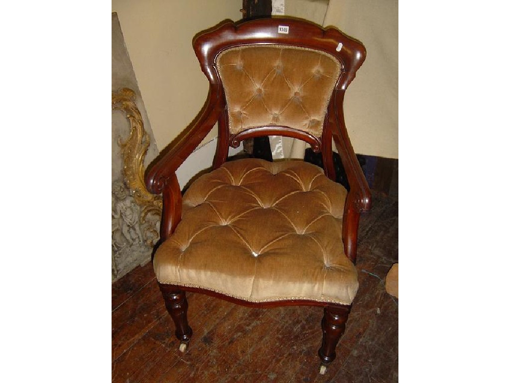 Appraisal: A Victorian mahogany open elbow chair with button upholstered seat