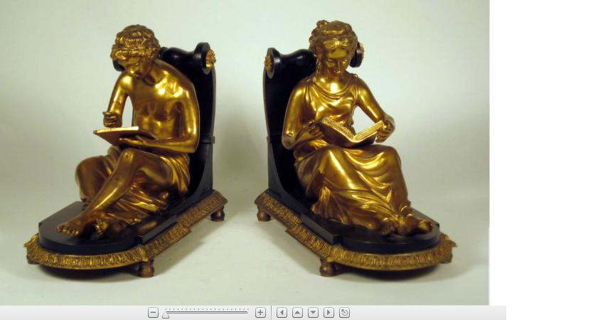 Appraisal: Pair of Empire style gilt and patinated metal book endsSeated