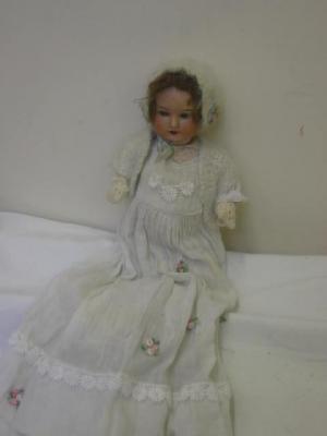 Appraisal: An Armand Marseille bisque headed doll with blue sleeping eyes