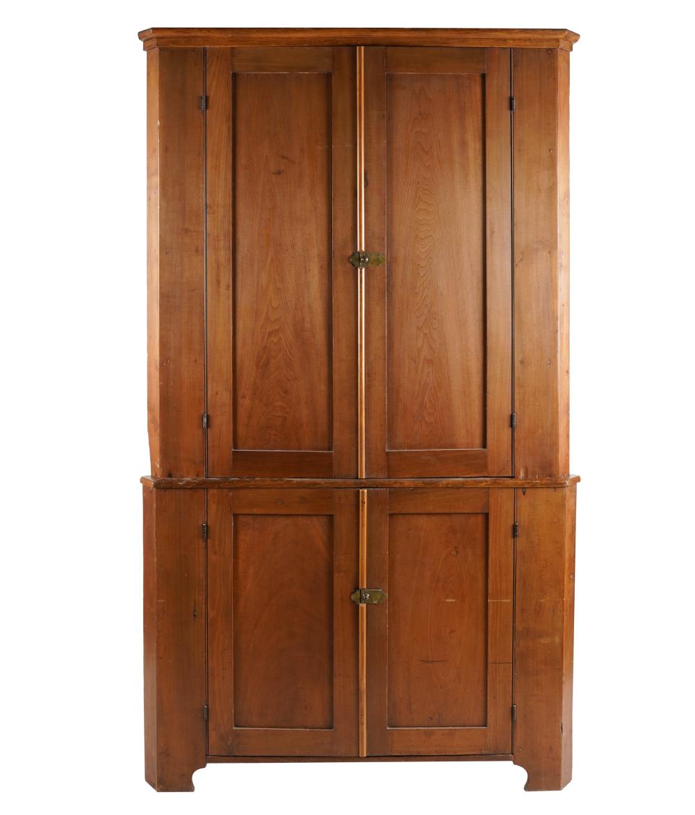 Appraisal: AMERICAN CORNER CABINETmixed woods with brass latches constructed in two