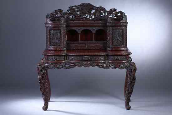 Appraisal: JAPANESE HARDWOOD DRAGON DESK Meiji Period In two sections the