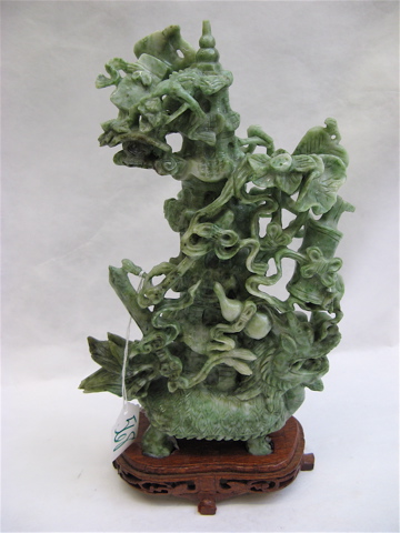 Appraisal: CHINESE CARVED JADE SCULPTURE variegated shades of green having a