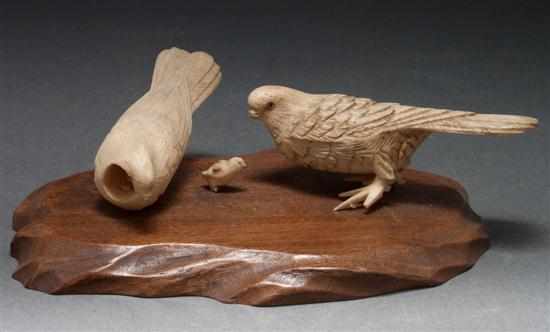 Appraisal: Chinese carved ivory bird group mounted on a wood base