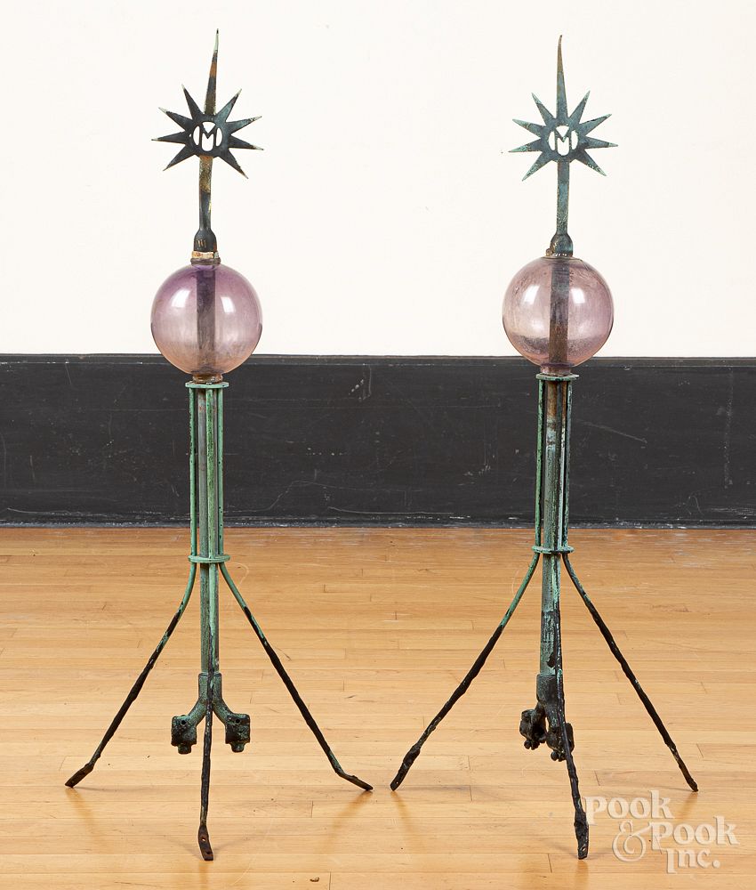 Appraisal: Pair of copper lightning rods with glass balls Pair of