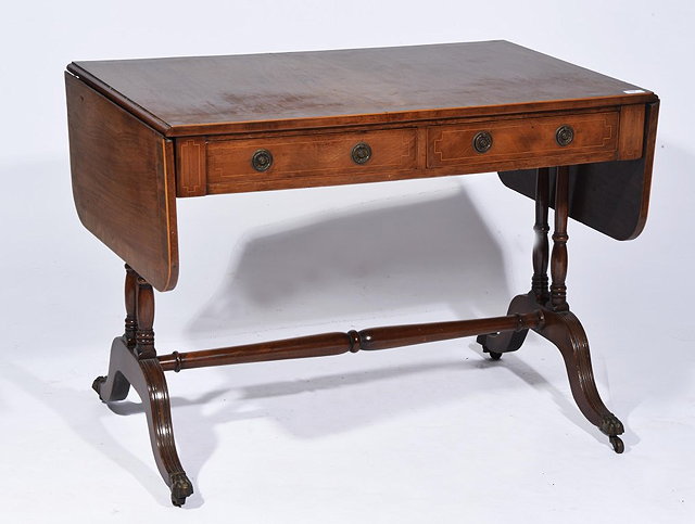 Appraisal: A REGENCY STYLE MAHOGANY SOFA TABLE with two short drawers