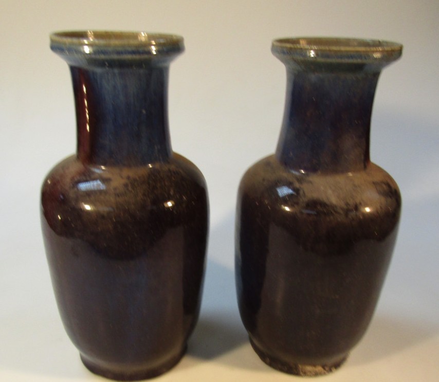 Appraisal: A pair of blue glazed vases each with shouldered bodies