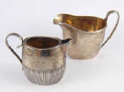 Appraisal: Two Victorian silver service cream jugs William Hutton London and